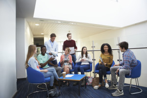 College Students Having Informal Meeting With Tutors